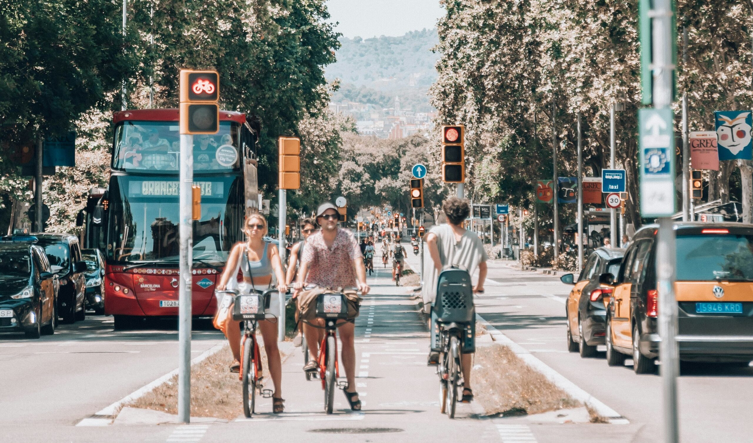 people using the bus and cycling in the city