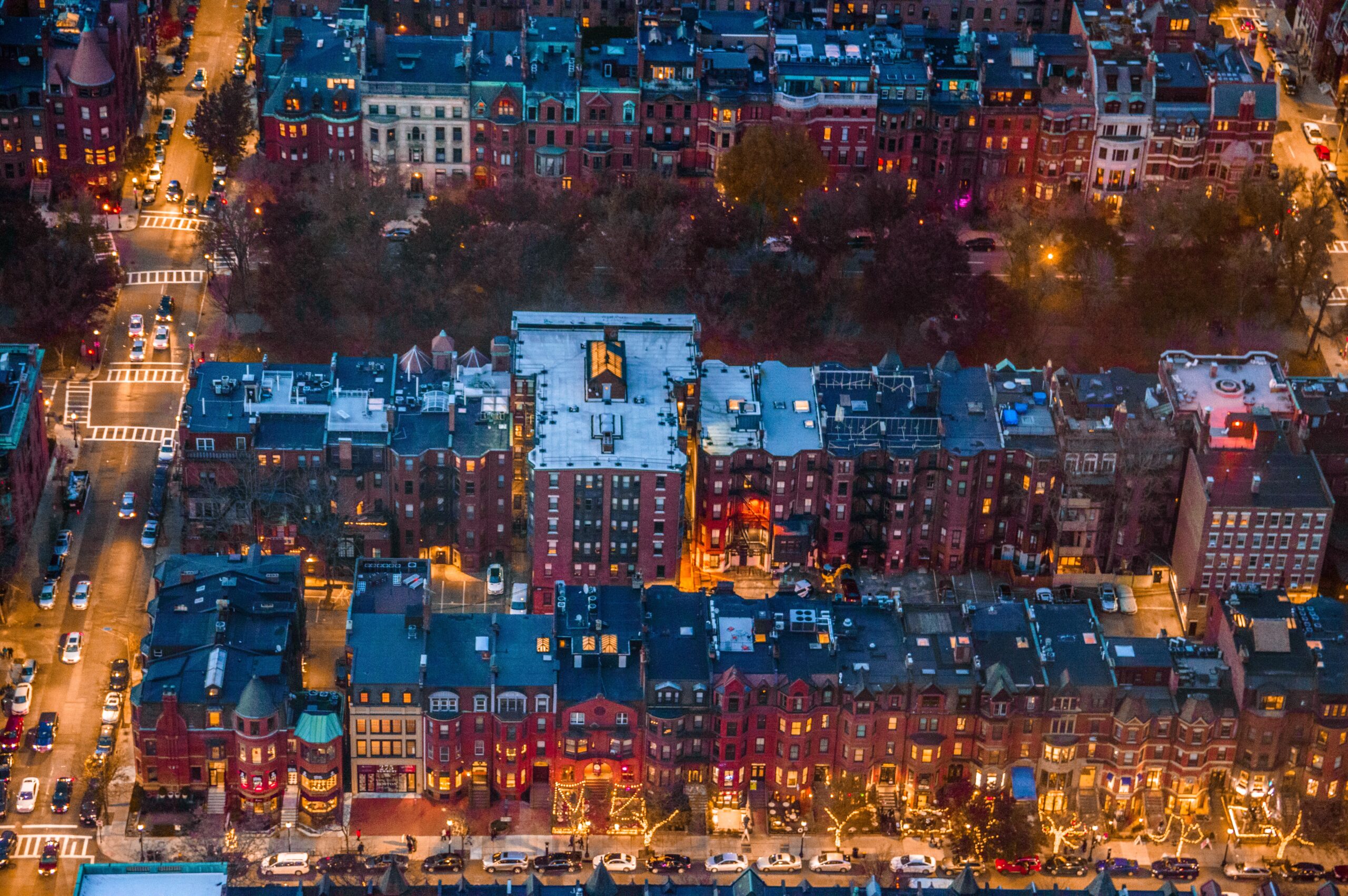 Aerial view of illuminated homes at night in Boston