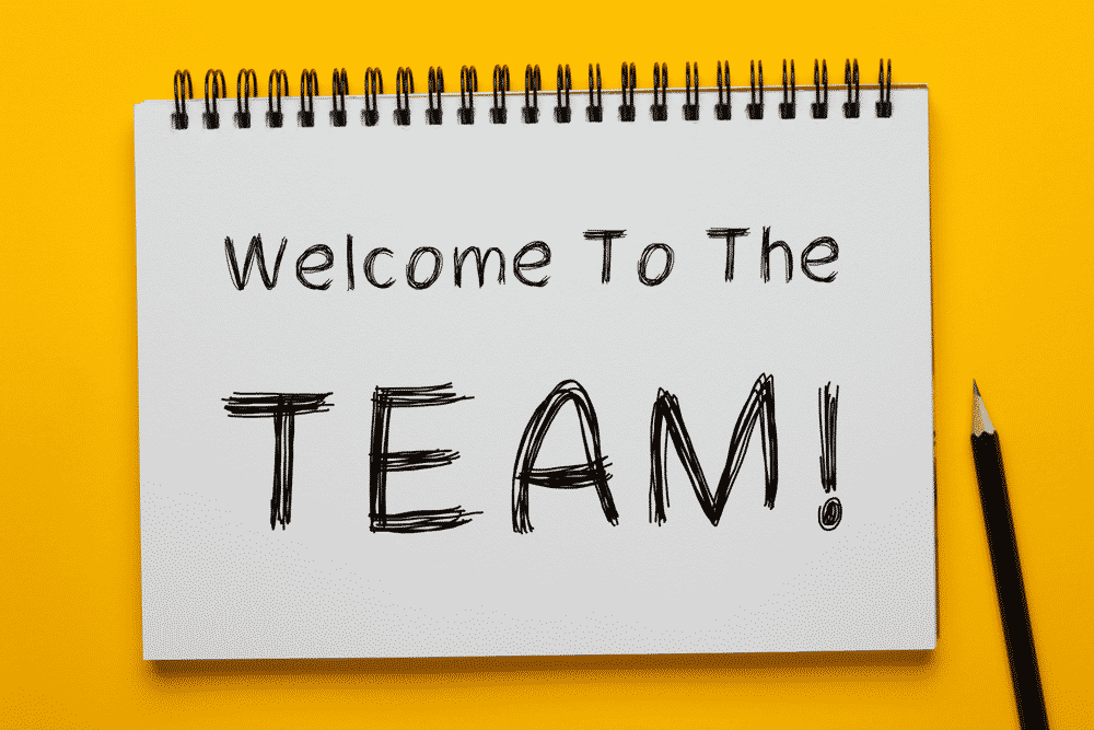 welcome to the team written on a notepad